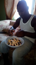 Gregory showing how to prepare ackee